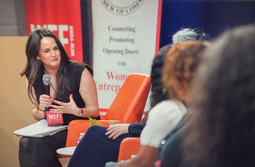 Contribute’s CEO moderating a panel at the Women’s Economic Forum